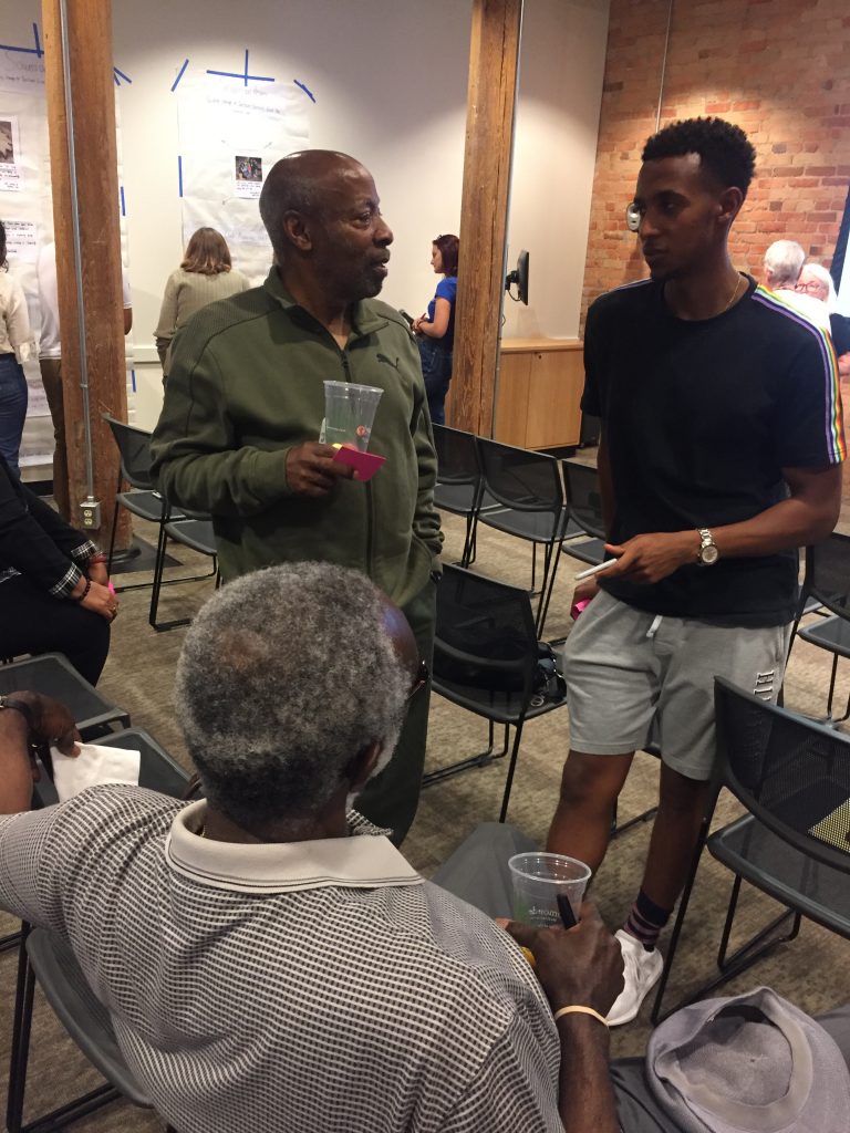 2019: Duke student Surafel Adere, club members Joe Wilson and Paul Lyons discuss gardening and memory.