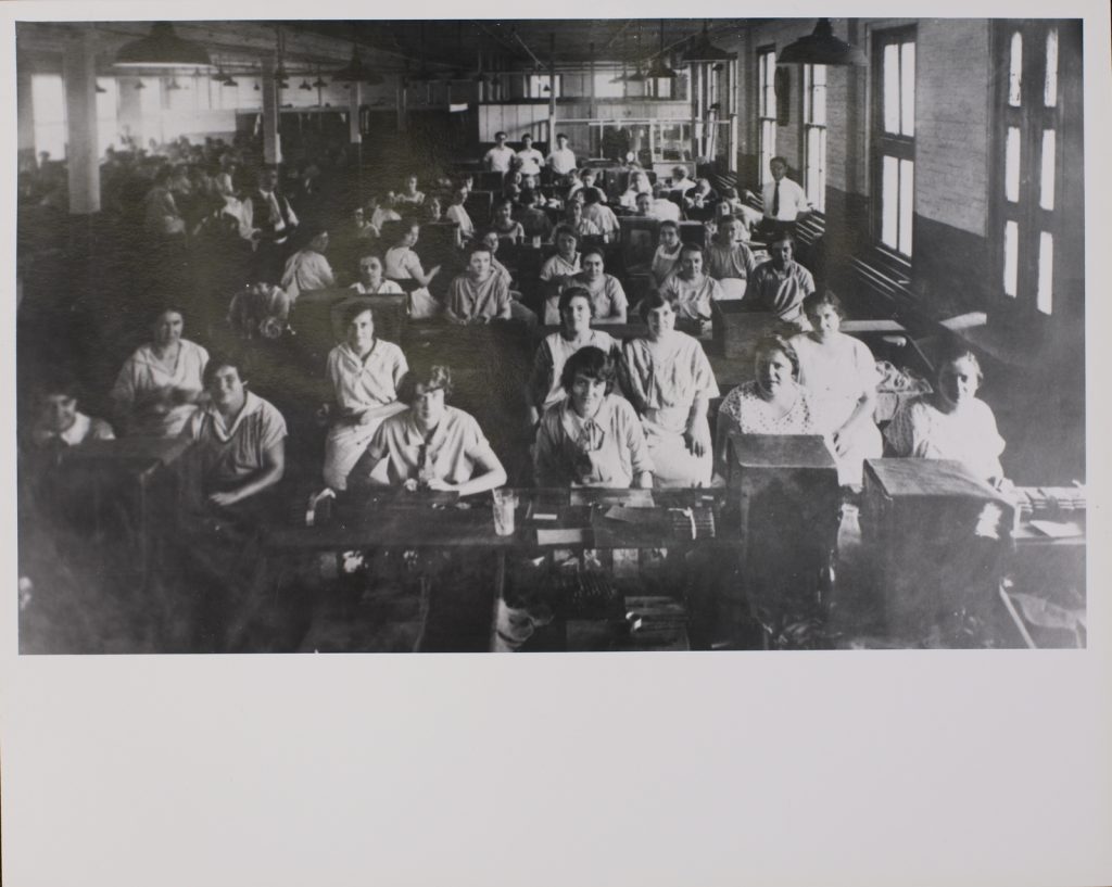 Ca. 1930: Immigrant workers in New Brunswick cigar factory.